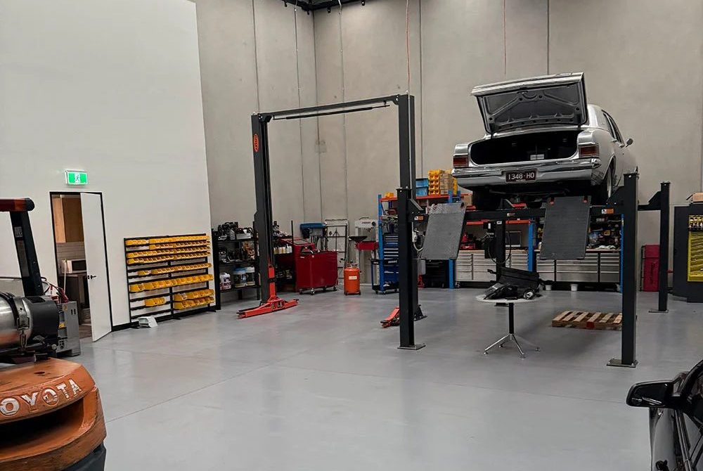 Inside the Veloce Tuning workshop with a vehicle hoist
